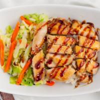 Chicken Teriyaki · Tender slices of chicken topped with teriyaki sauce. Steamed mixed vegetables and sesame see...