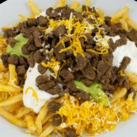 Fries With Carne Asada · Carne  Asada on top of Fries with Sour  Cream Guacamole , and Cheese.