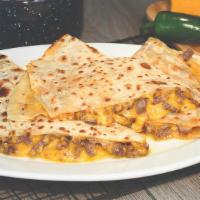 Quesadilla With Carne Asada · Carne Asada Meat placed in a Grilled Flour Tortilla folded with melted Cheddar Cheese
