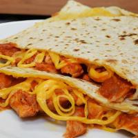 Quesadilla With Chicken · Shredded Chicken placed in a Grilled Flour Tortilla folded with melted Cheddar Cheese