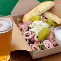 Antipasto Salad · House salad topped with sliced rolls of ham, mortadella and mozzarella cheese.