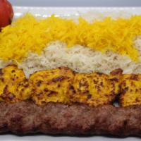 Combo Kabob · 1 Skewer of ground beef kabob, 1 skewer of chicken breast kabob accompanied by a grilled tom...