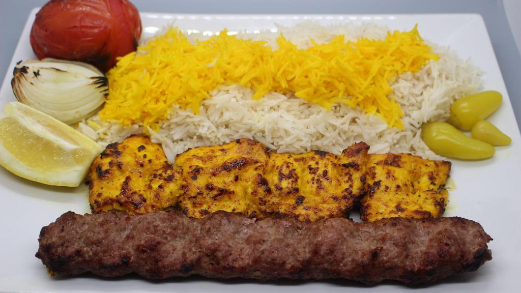 Combo Kabob · 1 Skewer of ground beef kabob, 1 skewer of chicken breast kabob accompanied by a grilled tomato, onion with white rice topped with saffron.