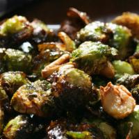 Charred Brussel Sprouts · Balsamic vinegar reduction, bacon, parmesan