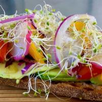 Avocado Toast · Grilled Larder Sourdough covered with fresh avocado, radish, cherry tomato, red onion, and s...