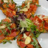 Bruschetta Al Pomodoro Fresco · Herbs toasted baguette bread, Roma tomatoes, sweet basil, garlic and extra virgin olive oil.