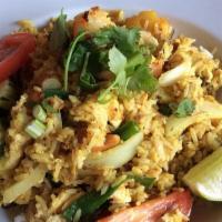 . Pineapple Fried Rice · Fried rice with , egg, pineapple, cashew nut, raisin, onion, and curry powder. WITH CHOICE O...