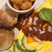 Chili Omelet Supreme · Filled with our house made all meat chili, onions, and cheddar cheese topped with sliced avo...