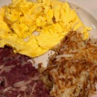 Housemade Corned Beef Hash And Eggs · Comes with choice of one side hash browns tater tots fresh fruit cottage cheese or sliced to...