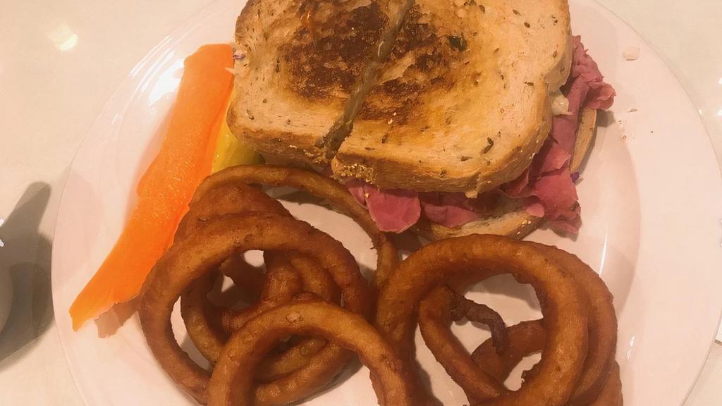 Reuben · Extra lean corned beef, Swiss cheese, sauerkraut and our homemade thousand island dressing on grilled rye bread.