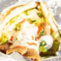 Lamb Gyro · Lamb cooked with a vertical broiler the authentic way, served on Pita with lettuce, cucumber...