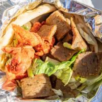 Habibi'S Gyro · The Habibi way -  A mix of our authentic lamb and chicken served on Pita with fries, lettuce...