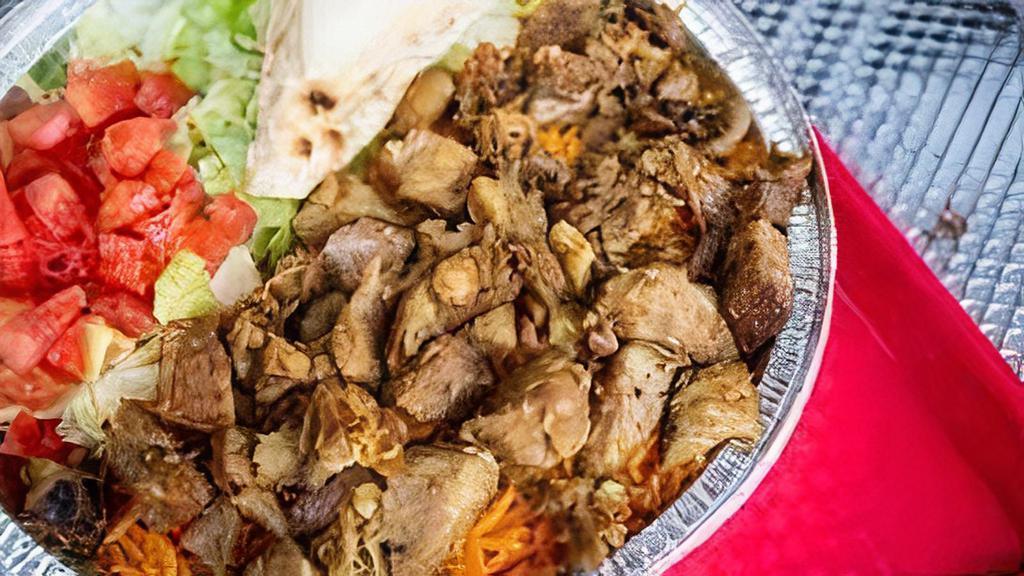 Lamb Platter · Lamb cooked with a vertical broiler the authentic way, served on Rice with salad, pita slices on the side topped off with homemade tzitiki sauce, white sauce and hot sauce.