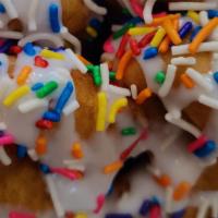 Birthday Cake · Mini donuts topped with vanilla glaze and colorful sprinkles.