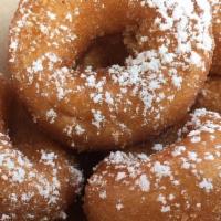 French Toast (Half Dozen) · Mini donuts topped with powdered sugar and maple syrup dipping cup. Classic breakfast favori...