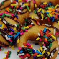 Chocolate Sprinkle (Half Dozen) · Mini donuts topped with chocolate sauce and colorful sprinkles.