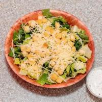 Caesar · Romaine lettuce, shredded Parmesan cheese, croutons.
