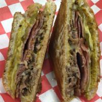 Cubaño · Thinly sliced mojo-marinated pulled pork shoulder, ham, swiss cheese, half-sour dill pickles...