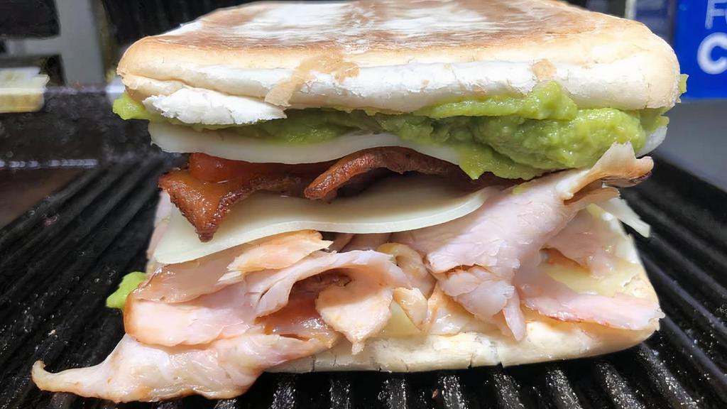 Turkey, Bacon, Avocado And Swiss · Mesquite turkey breast, bacon, avocado, swiss cheese, sliced roasted red pepper, mayo, on a grilled ciabatta roll.