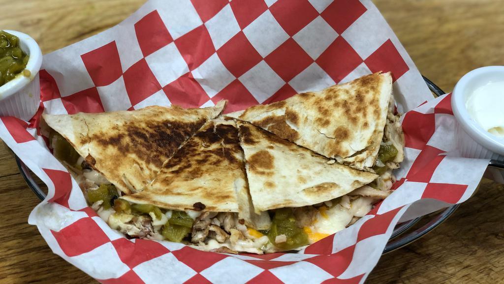 Pulled Pork Quesadilla · Smoked pork butt, three-cheese blend, spicy salsa Verde in a grilled flour tortilla with sour cream and guacamole.