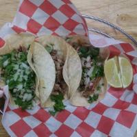 Street Tacos (3) · Traditional style with smoked pork, onion, lime, cilantro, on soft corn tortillas served wit...