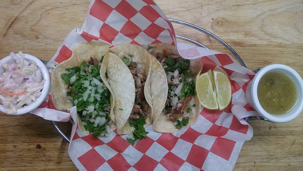 Street Tacos (3) · Traditional style with smoked pork, onion, lime, cilantro, on soft corn tortillas served with coleslaw and salsa. Includes 3 tacos.