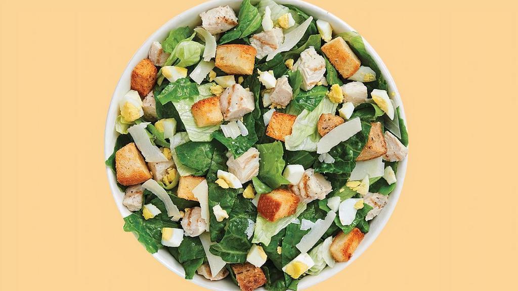 Grilled Chicken Caesar Salad · Our Grilled Chicken Caesar comes recommended with a base of Romaine/Iceberg Blend. It is served with Grilled Chicken, Sliced Egg, Parmesan Cheese and Housemade Croutons. We recommend our Classic Caesar dressing.