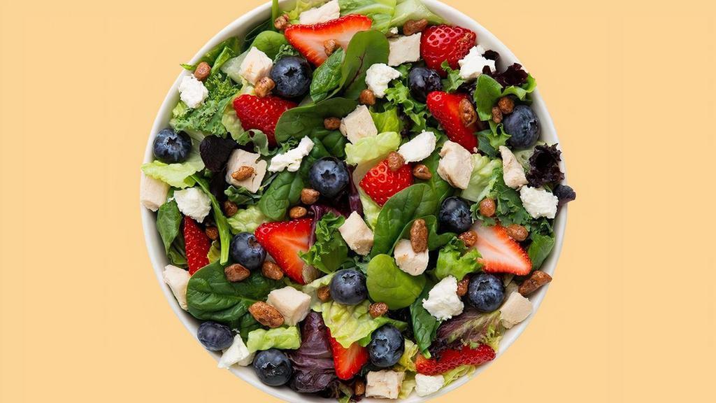 Summer Berry Salad · super greens blend, grilled chicken, strawberries, blueberries, feta, honey roasted pecans, topped with balsamic vinaigrette.