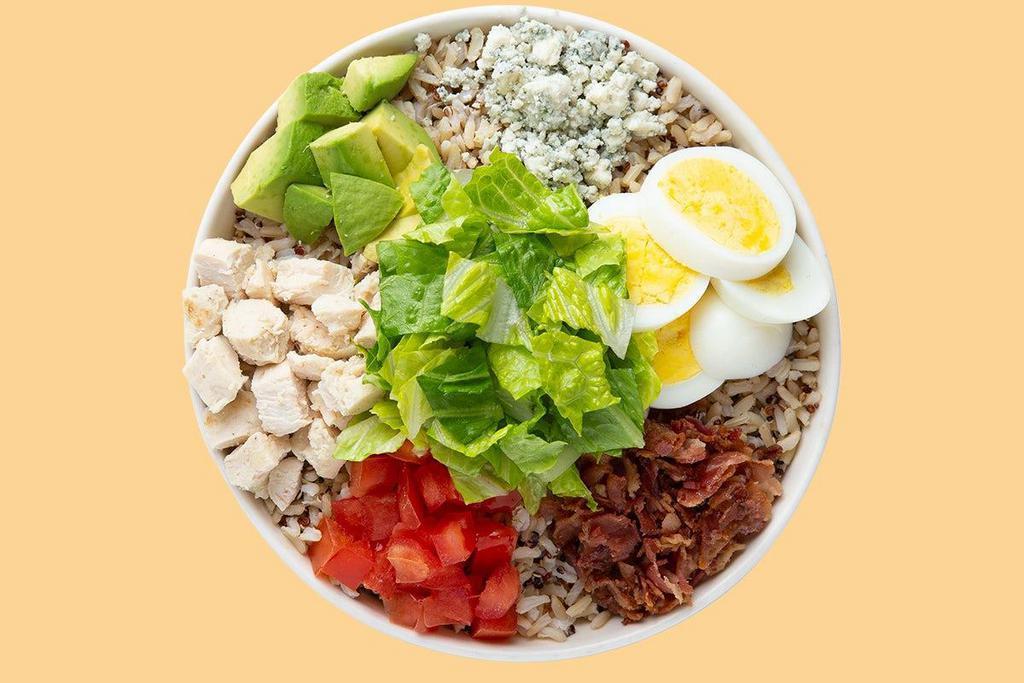 Avocado Cobb Warm Grain Bowl · Fresh Avocado enhances this timeless classic! Starting with the Super Grains Blend. It is served with Grilled Chicken, Diced Tomatoes, Fresh Avocado, Sliced Egg, Smoky Bacon and Bleu Cheese. We recommend our Thousand Island dressing.
