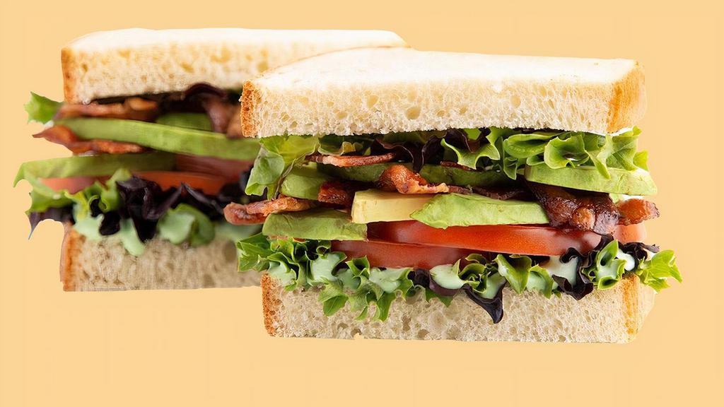 Avocado Blt Sandwich · Enjoy our version of a timeless favorite! We're adding Fresh-sliced Avocado and our Green Goddess dressing to take the classic Bacon, Lettuce &Tomato sandwich to a whole new level! Served between two slices of our delicious Rustic White bread.