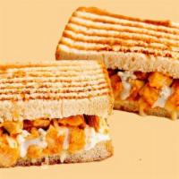 Buffalo Chicken Panini Melt · A sandwich so hot . . . it's cool! This Panini Melt is made with spicy-hot Grilled Buffalo C...
