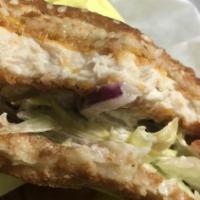 Fish Sandwich · Tartar sauce, lettuce, tomato, pickles, onion.