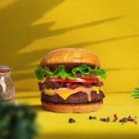 The New Classic Vegan Burger · Seasoned Beyond meat patty topped with lettuce, tomato, onion, and pickles. Served on a bun.
