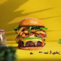 Locked And Loaded Burger · Seasoned Beyond meat patty topped with fries, avocado, melted vegan cheese, onion, lettuce, ...