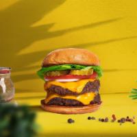 Cloned Cheese Burger · Two seasoned Beyond meat patties topped with melted vegan cheese, lettuce, tomato, onion, an...
