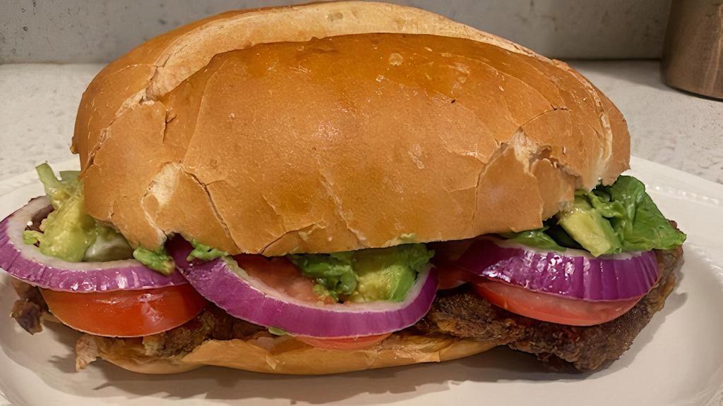 Fried Beef Torta/ Milanesa Torta · A cut of beef seasoned and breaded, then fried.
 Comes with lettuce, tomato, red onion, avocado, and a home made mild chipotle spread.