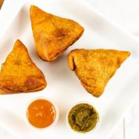 Samosa Vegetable · Crisp turnover filled with mildly spiced potato, and peas.