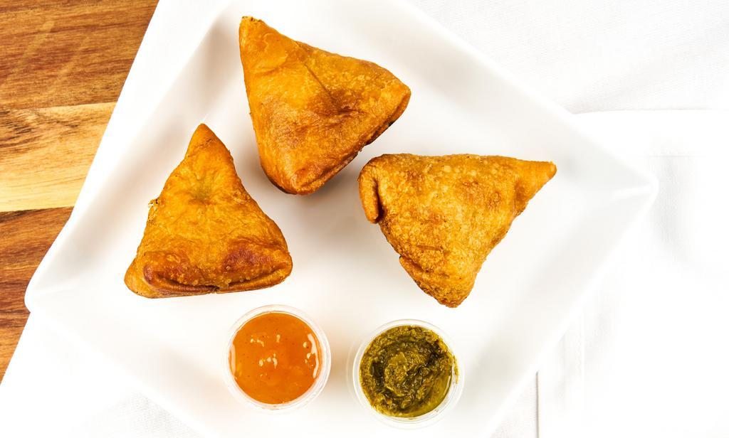 Samosa Vegetable · Crisp turnover filled with mildly spiced potato, and peas.