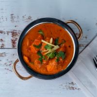 Chicken Tikka Masala · Pieces of chicken tikka cooked in a creamy sauce with fresh tomatoes, and Indian spices.