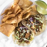 Caribbean Carne Asada Taco · Seared steak seasoned with island style spices. Served with lime and tortilla chips. Choose ...