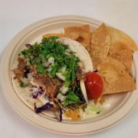 Carnitas Taco · Slow roasted pork. Served with lime and tortilla chips. Choose corn, flour, or lettuce wrap,...
