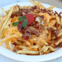 Rasta Fries · Crispy French fries topped with crispy bacon and cheese.