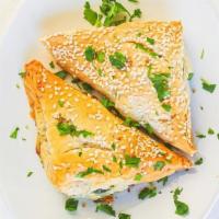 Spanakopita. · Spinach & feta cheese pie wrapped in phyllo