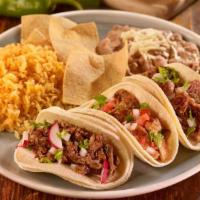 Tacos Al Gusto Plate · Served with rice and refried beans, choice of green or red salsa, cilantro, onions, and lime.