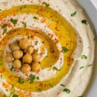 Hummus · House cooked and blended chickpeas, sesame paste, olive oil, lemon juice and seasoning, serv...