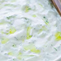Tzatziki · Homemade tzatziki with yogurt, fresh garlic, cucumber, seasonings, served with pita bread