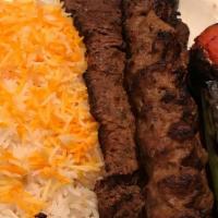 Kebab · Served with rice, summer salad, pita bread and meat cooked on a fire flamed grill