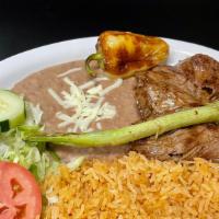 Carne Asada · grilled Skirt steak (arrachera) served with rice and beans and tortillas.