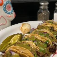 Tacos · Served on a soft yellow corn tortilla, choice of meat, choice of salsa, diced red onions, an...