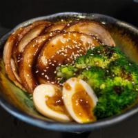Chashu Don · Six pieces chashu over rice with teriyaki sauce. Broccoli and 2 gyoza Sesame Seed, onion on ...